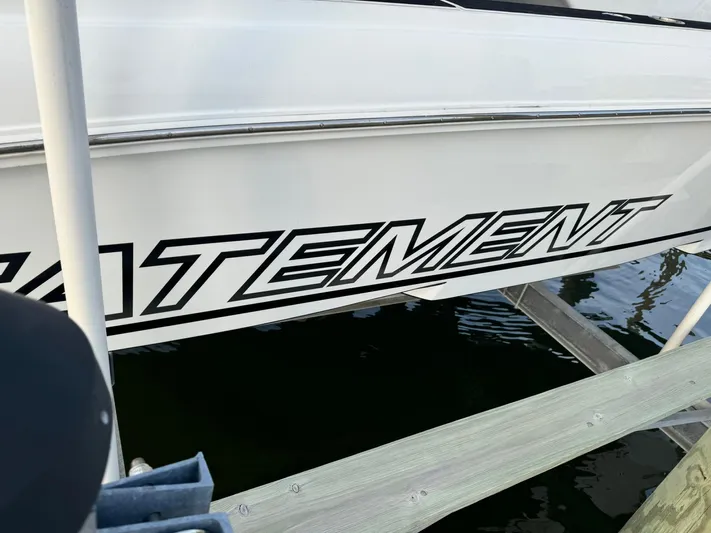  Yacht Photos Pics 2018 Statement 35 CC boat docked, showcasing bold lettering on the side.