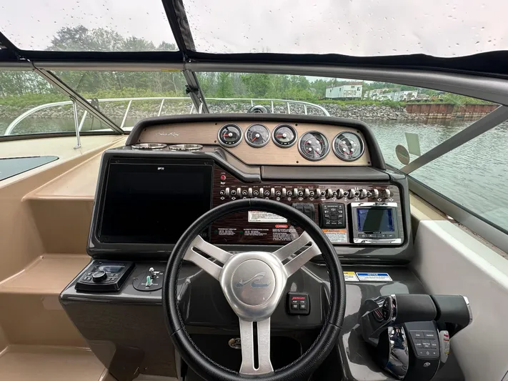  Yacht Photos Pics 2017 Sea Ray Sundancer 310 helm with gauges, controls, and navigation system.