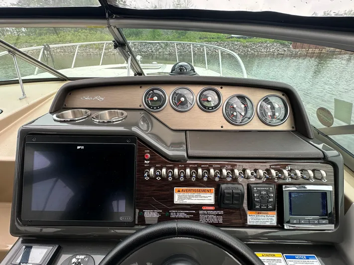  Yacht Photos Pics 2017 Sea Ray Sundancer 310 dashboard with gauges, controls, and navigation screens.