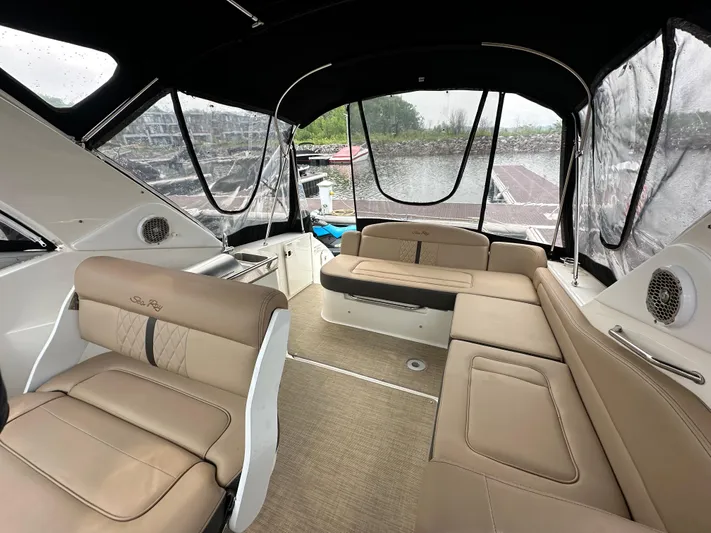  Yacht Photos Pics 2017 Sea Ray Sundancer 310 interior with beige seating and panoramic windows.