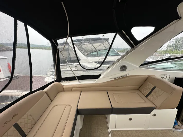  Yacht Photos Pics Interior of 2017 Sea Ray Sundancer 310 with beige seating and lake view.