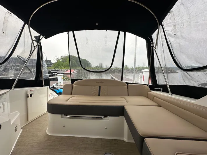  Yacht Photos Pics 2017 Sea Ray Sundancer 310 interior with beige seating and canopy.
