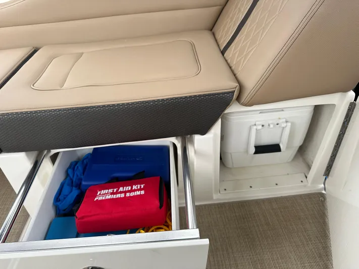  Yacht Photos Pics 2017 Sea Ray Sundancer 310 interior with storage drawer and first aid kit.