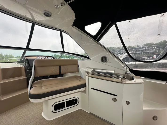  Yacht Photos Pics Interior of 2017 Sea Ray Sundancer 310 boat with seating and kitchenette.