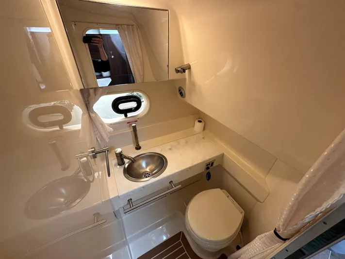  Yacht Photos Pics 2017 Sea Ray Sundancer 310 bathroom with sink, toilet, and mirror.