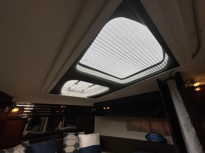  Yacht Photos Pics Interior cabin view of 2017 Sea Ray Sundancer 310 with skylight and cushions.