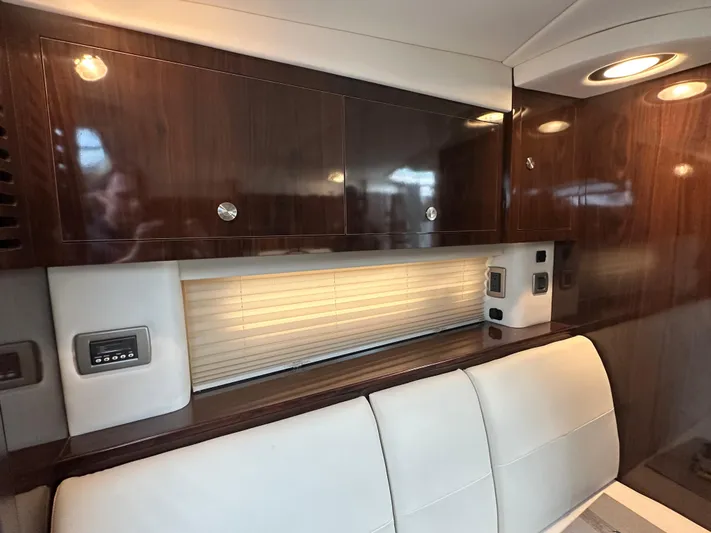  Yacht Photos Pics 2017 Sea Ray Sundancer 310 interior with sleek wood cabinets and modern lighting.