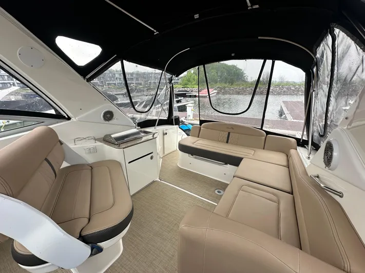  Yacht Photos Pics Interior of 2017 Sea Ray Sundancer 310 boat with beige seating and covered deck.