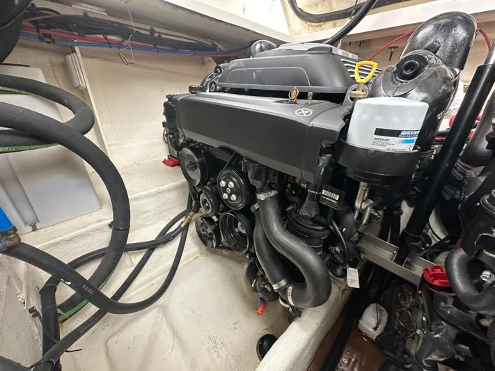  Yacht Photos Pics Engine compartment of a 2017 Sea Ray Sundancer 310 boat, showcasing detailed components.