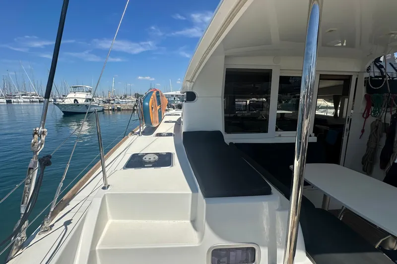  Yacht Photos Pics 2018 Lagoon 40 catamaran docked at marina, featuring spacious deck and seating area.