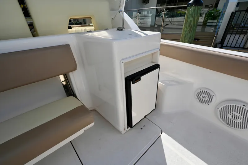 Amejaie II Yacht Photos Pics Interior of 2000 Tiara Yachts 3500 Express with seating and mini fridge.