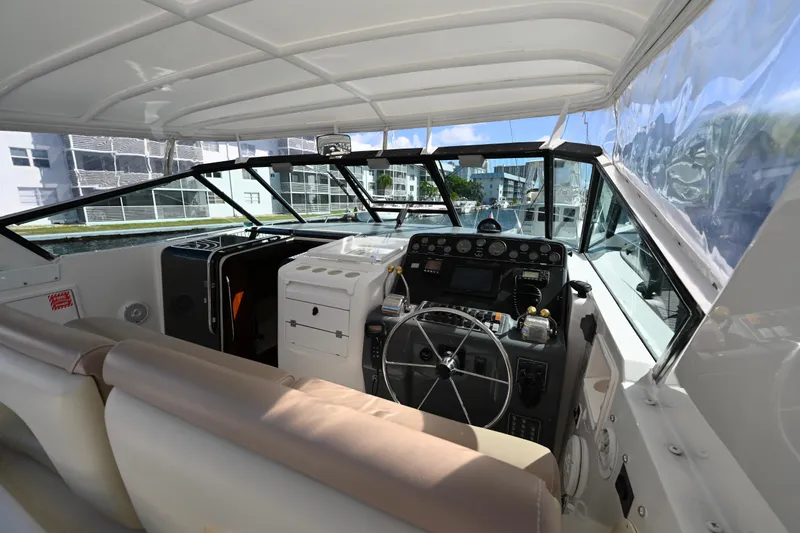 Amejaie II Yacht Photos Pics Interior view of 2000 Tiara Yachts 3500 Express cockpit with steering wheel and control panel.