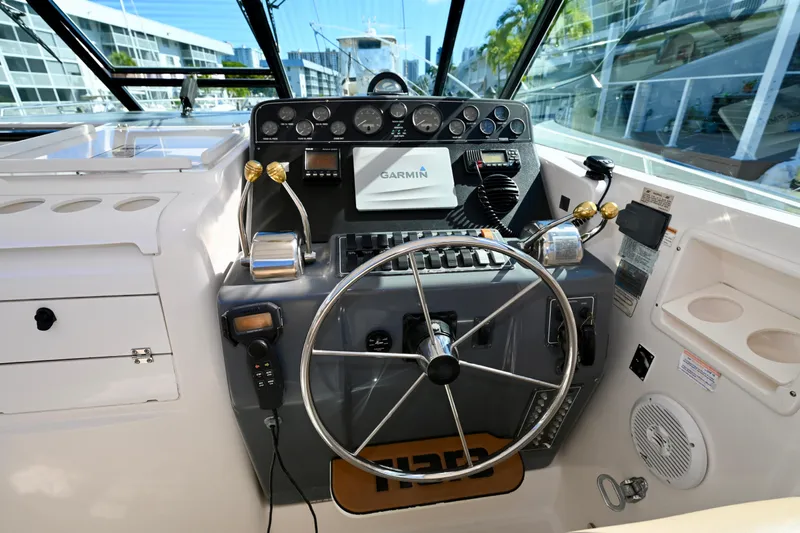 Amejaie II Yacht Photos Pics Helm of 2000 Tiara Yachts 3500 Express with Garmin navigation system and controls.