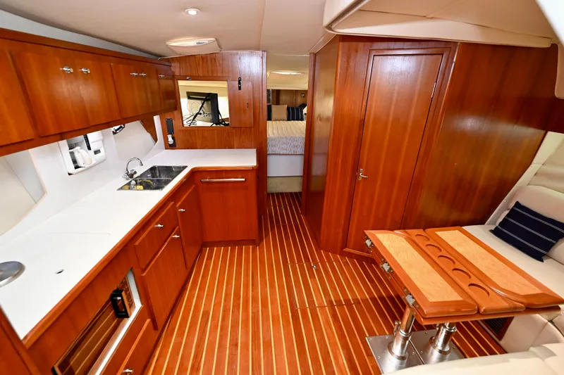 Amejaie II Yacht Photos Pics Luxurious interior of 2000 Tiara Yachts 3500 Express with wood finishes and modern amenities.