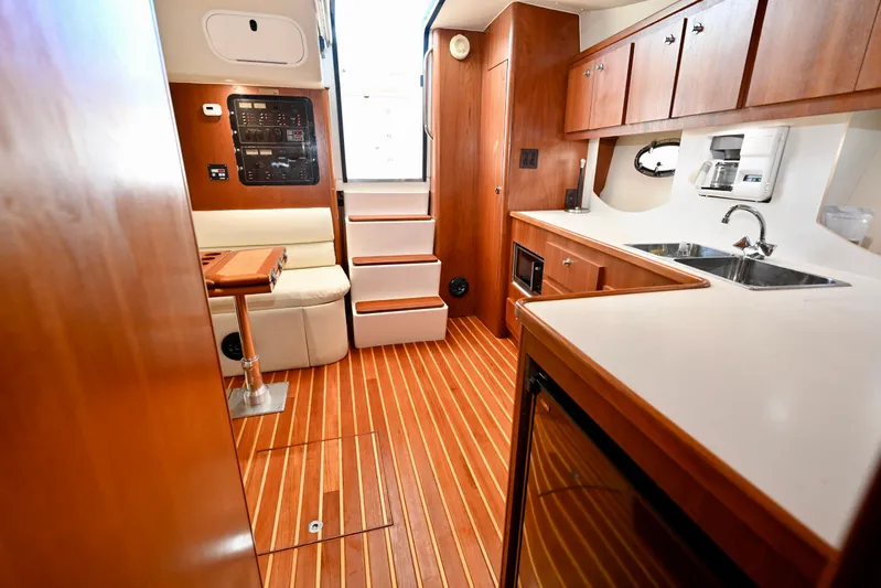 Amejaie II Yacht Photos Pics Interior of 2000 Tiara Yachts 3500 Express with wood flooring and modern amenities.