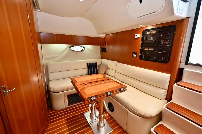 Amejaie II Yacht Photos Pics Luxurious interior of 2000 Tiara Yachts 3500 Express with wood accents and plush seating.