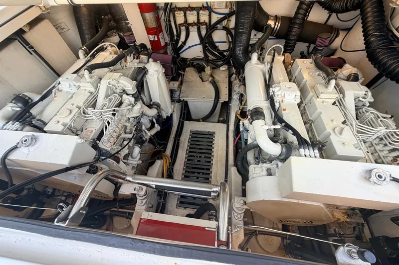 Amejaie II Yacht Photos Pics Engine room of a 2000 Tiara Yachts 3500 Express, showcasing dual engines and mechanical components.