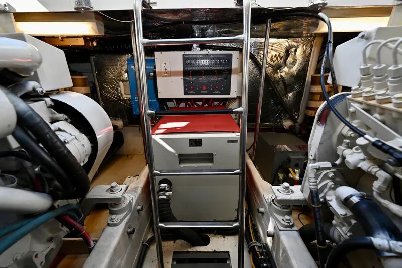 Amejaie II Yacht Photos Pics Engine room of a 2000 Tiara Yachts 3500 Express, featuring control panel and machinery.