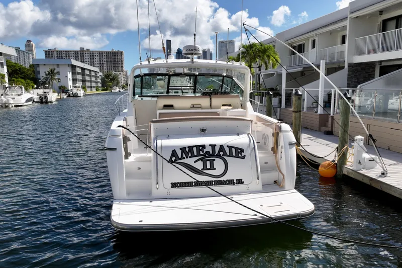 Amejaie II Yacht Photos Pics 2000 Tiara Yachts 3500 Express docked in a sunny marina setting.
