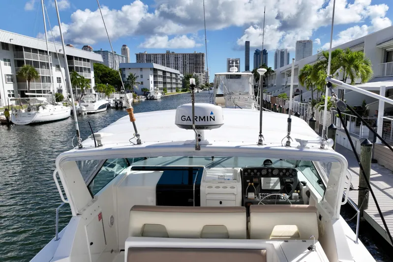 Amejaie II Yacht Photos Pics 2000 Tiara Yachts 3500 Express docked in a scenic marina with city skyline.