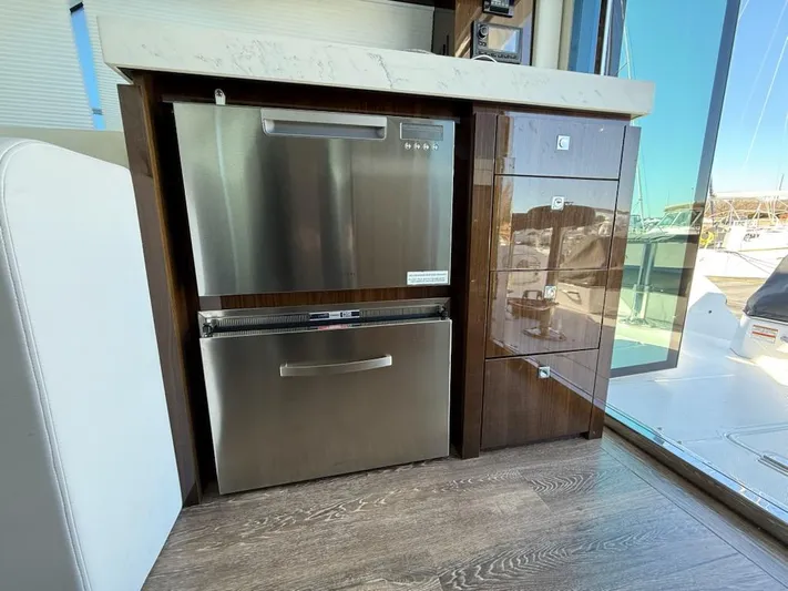 Emilia Yacht Photos Pics 2022 Cruisers Yachts 54 Cantius interior with stainless steel appliances and modern cabinetry.