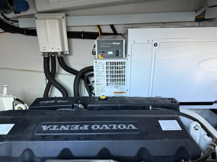 Emilia Yacht Photos Pics Engine room of 2022 Cruisers Yachts 54 Cantius with Volvo Penta and Cummins Onan generator.