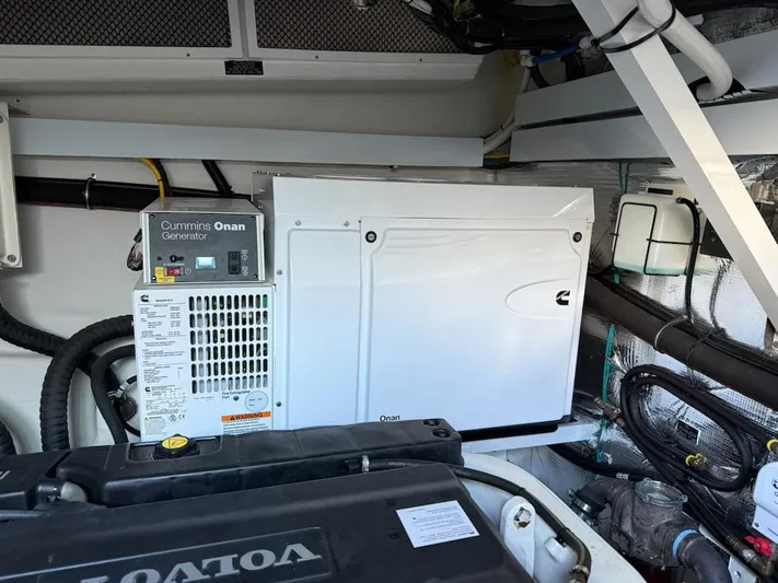 Emilia Yacht Photos Pics Engine room of 2022 Cruisers Yachts 54 Cantius with Cummins Onan generator.