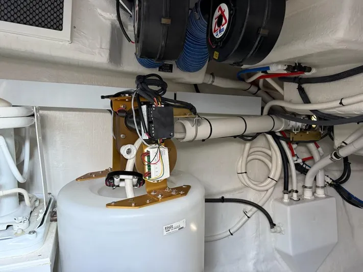 Emilia Yacht Photos Pics Engine room of 2022 Cruisers Yachts 54 Cantius with mechanical components and wiring.