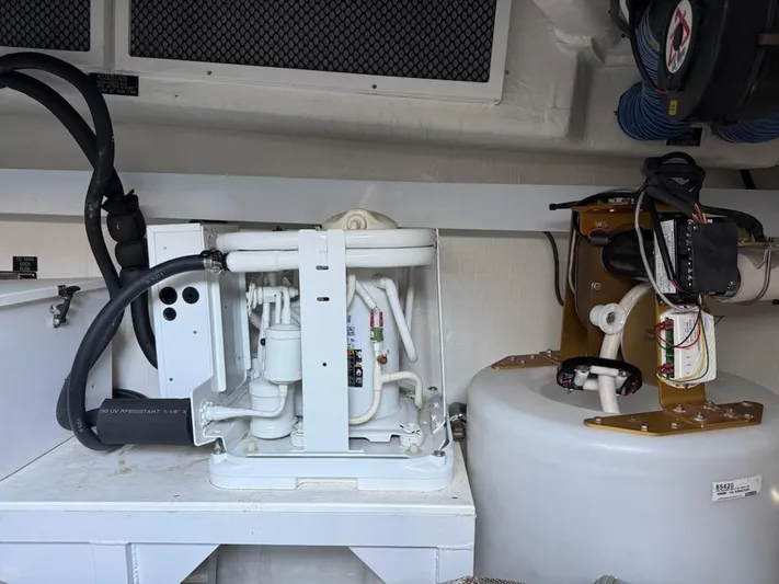 Emilia Yacht Photos Pics Engine room of 2022 Cruisers Yachts 54 Cantius, showcasing mechanical components and systems.