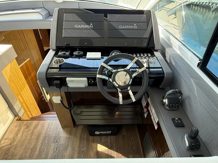 Emilia Yacht Photos Pics Helm of 2022 Cruisers Yachts 54 Cantius with Garmin navigation system.