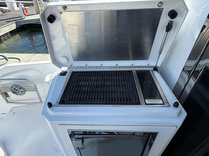 Emilia Yacht Photos Pics Outdoor grill on 2022 Cruisers Yachts 54 Cantius, dockside view.