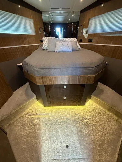 Emilia Yacht Photos Pics Luxurious bedroom interior of 2022 Cruisers Yachts 54 Cantius with modern design and ambient lighting.