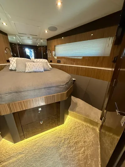 Emilia Yacht Photos Pics Luxurious bedroom interior of 2022 Cruisers Yachts 54 Cantius with modern design and ambient lighting.
