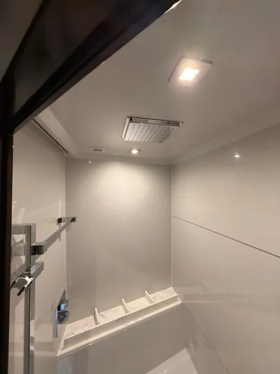 Emilia Yacht Photos Pics Luxurious shower interior on 2022 Cruisers Yachts 54 Cantius, featuring modern fixtures and lighting.