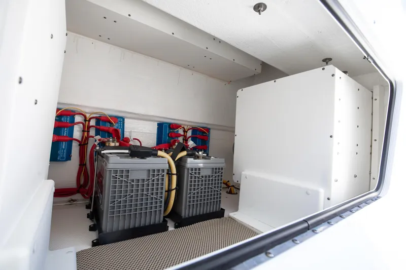 Emanon Yacht Photos Pics Electrical system of 2021 Invincible 35 Center Console boat, featuring batteries and wiring.