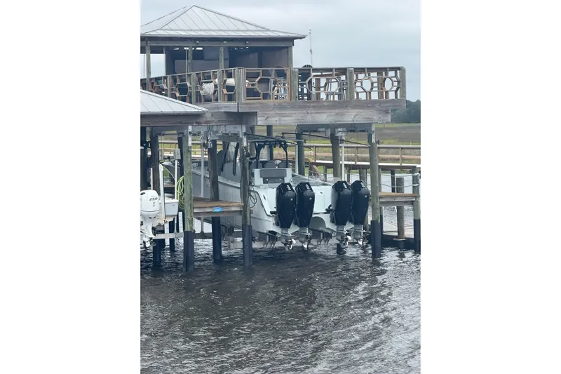  Yacht Photos Pics 2025 Front Runner 37 Catamaran docked with multiple outboard engines.