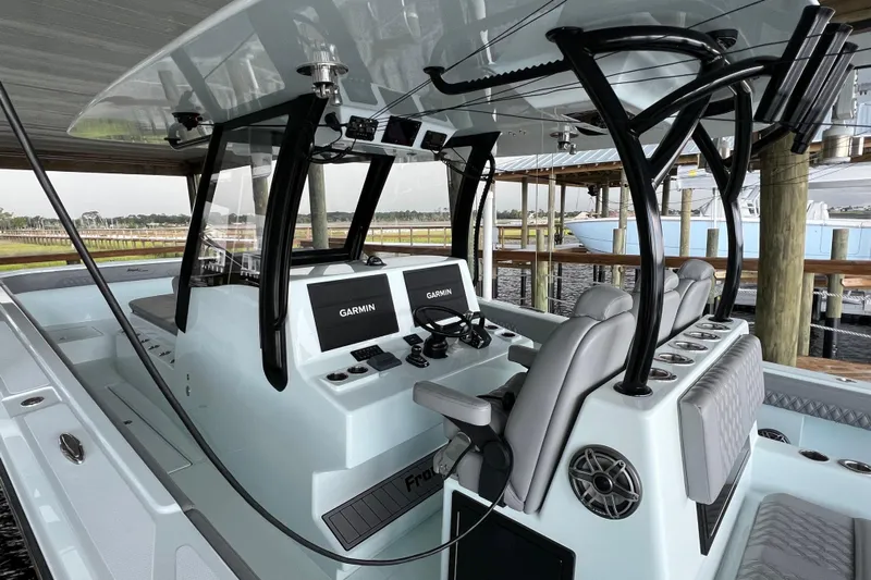  Yacht Photos Pics 2025 Front Runner 37 Catamaran interior with Garmin navigation system and sleek seating.