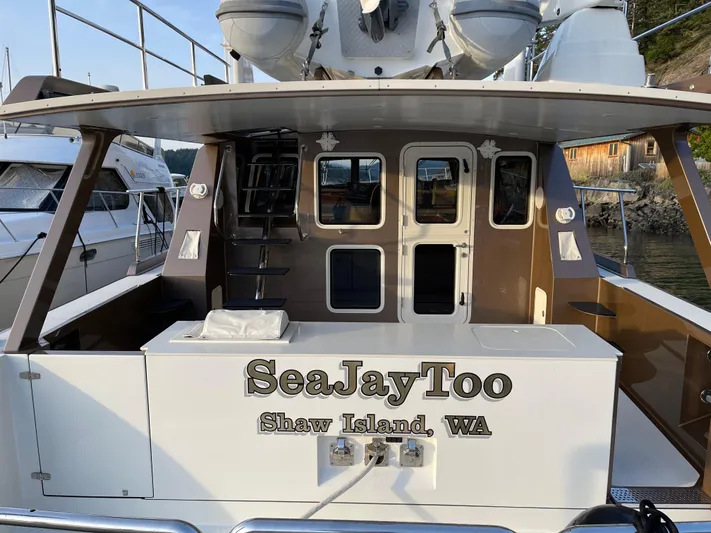  Yacht Photos Pics Coastal Craft 56 yacht "SeaJayToo" docked at Shaw Island, WA, rear view, 2012 model.
