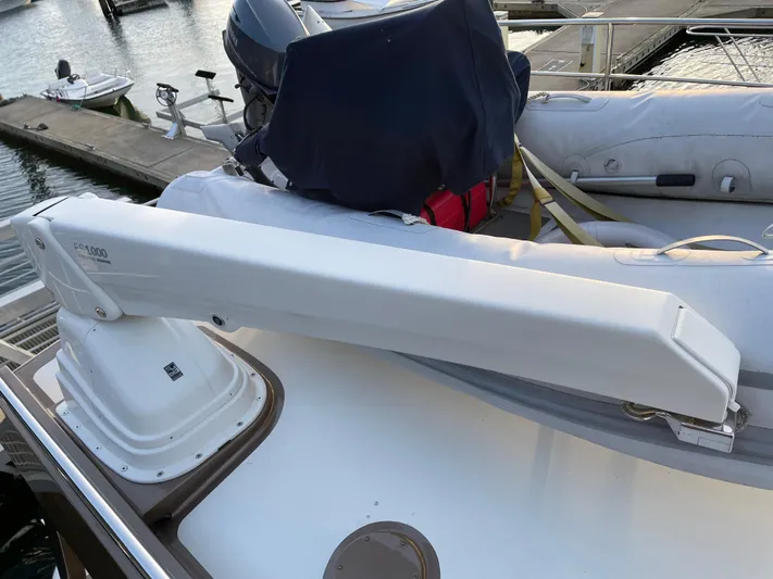  Yacht Photos Pics Coastal Craft 56 yacht deck with crane, 2012 model, docked at marina.