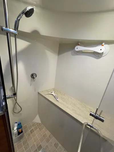  Yacht Photos Pics Shower area in 2012 Coastal Craft 56 yacht with modern fixtures and tiled floor.