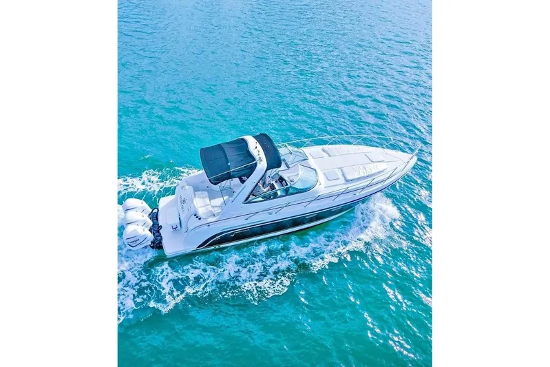  Yacht Photos Pics 2003 Formula 34 Performance Cruiser navigating clear blue waters.