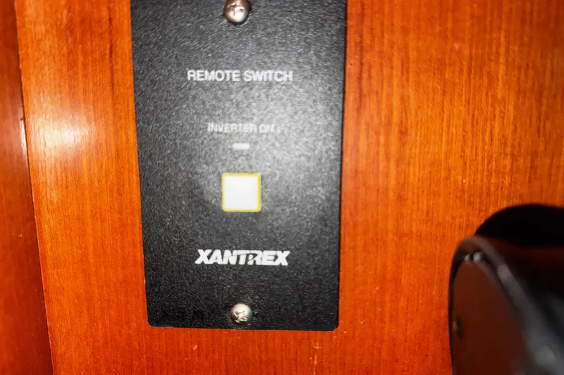 Still In The Moment Yacht Photos Pics Xantrex remote switch on 2007 Beneteau 423 yacht, mounted on wooden panel.