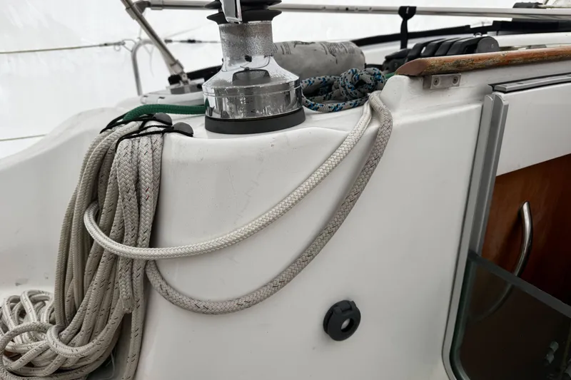Still In The Moment Yacht Photos Pics Close-up of 2007 Beneteau 423 sailboat winch and ropes on deck.