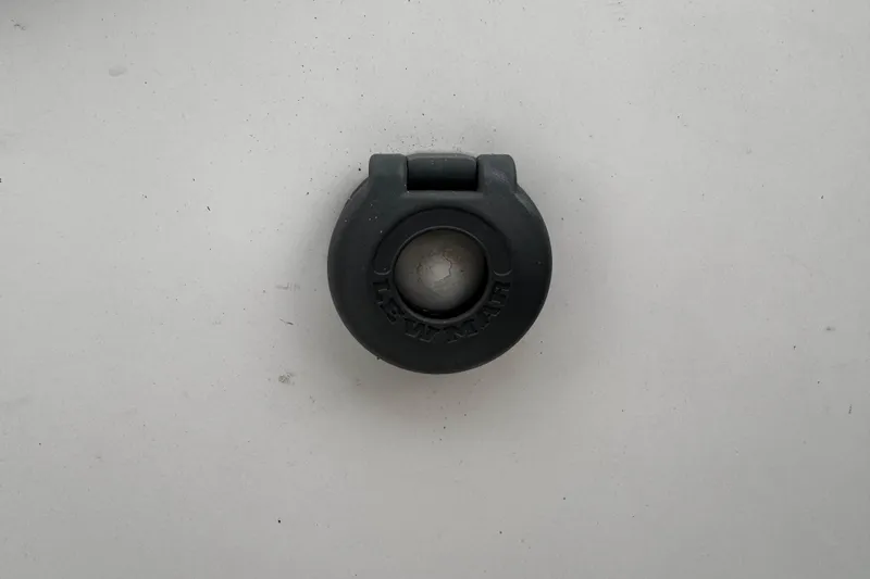 Still In The Moment Yacht Photos Pics Close-up of a black deck fitting on a 2007 Beneteau 423 sailboat.