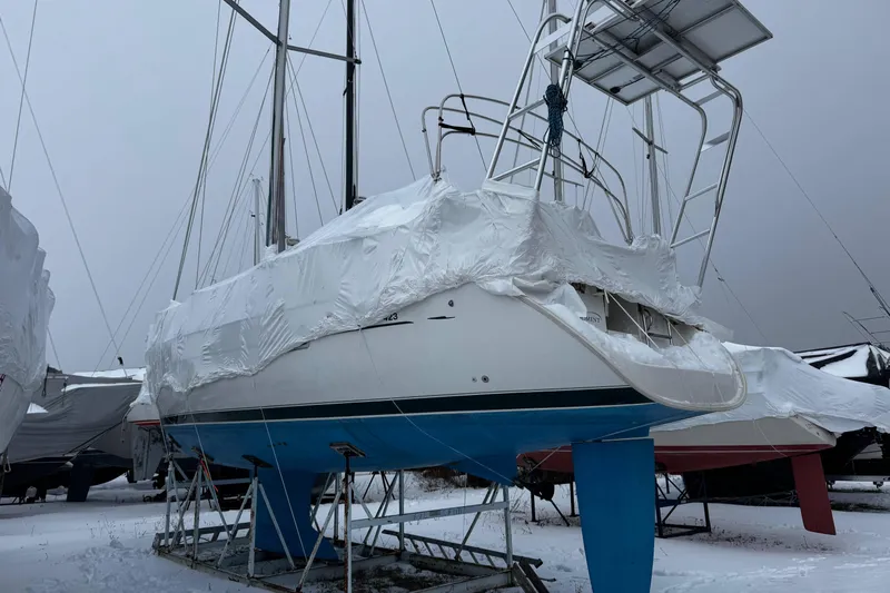 Still In The Moment Yacht Photos Pics 2007 Beneteau 423 sailboat covered in winter storage wrap.