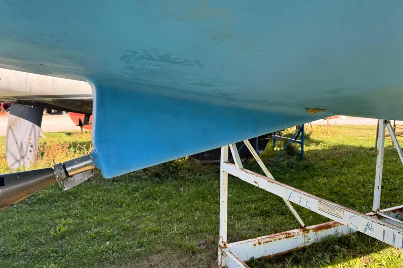 Still In The Moment Yacht Photos Pics 2007 Beneteau 423 sailboat hull on stand, showing keel and rudder details.