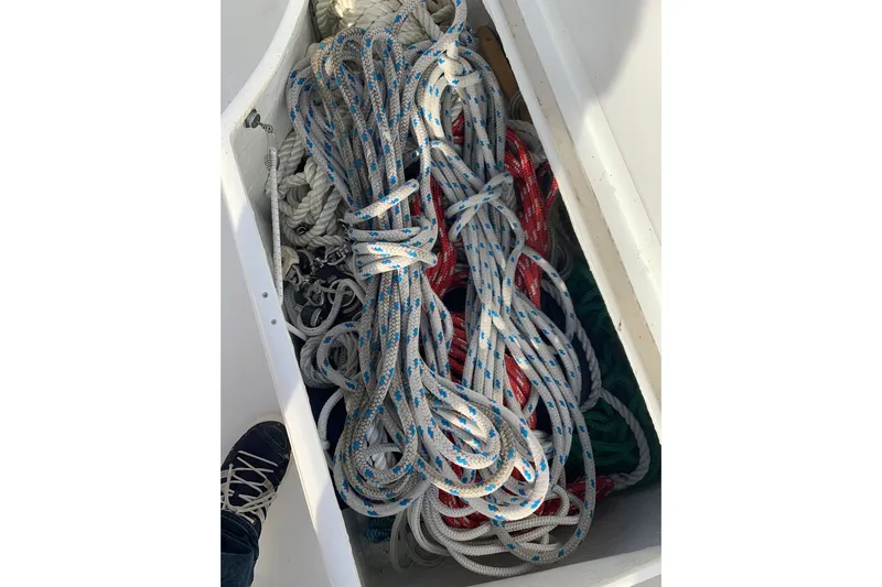 Still In The Moment Yacht Photos Pics Ropes stored in a compartment on a 2007 Beneteau 423 sailboat.