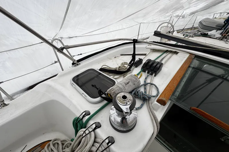 Still In The Moment Yacht Photos Pics Deck of 2007 Beneteau 423 sailboat with ropes and winch under sail.