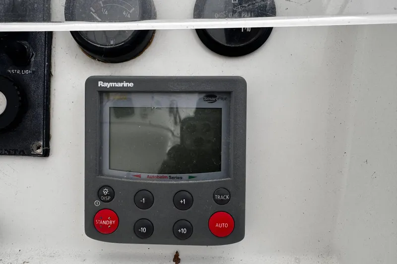 Still In The Moment Yacht Photos Pics Raymarine autopilot control on 2007 Beneteau 423 yacht dashboard.