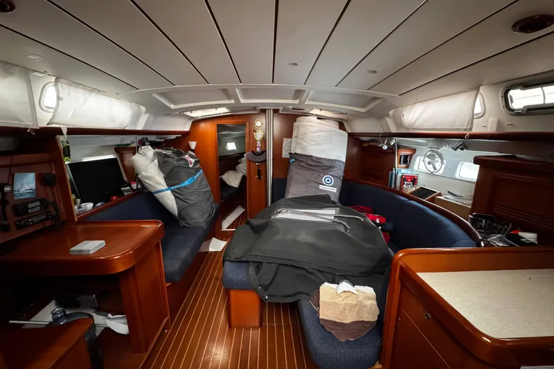 Still In The Moment Yacht Photos Pics Interior of a 2007 Beneteau 423 sailboat, featuring a cozy cabin layout.